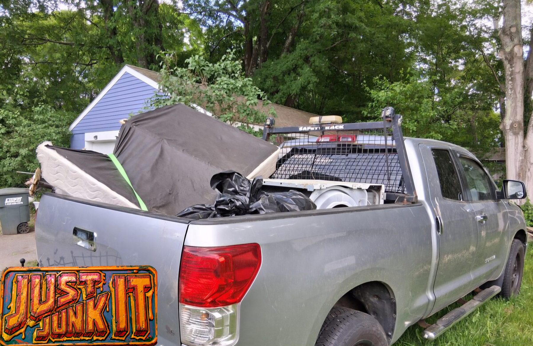 Just Junk It truck loaded with a job in Preston, CT